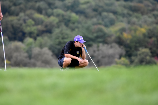 Aidan Melville lines up a putt. Aidan Melville lines up a putt.