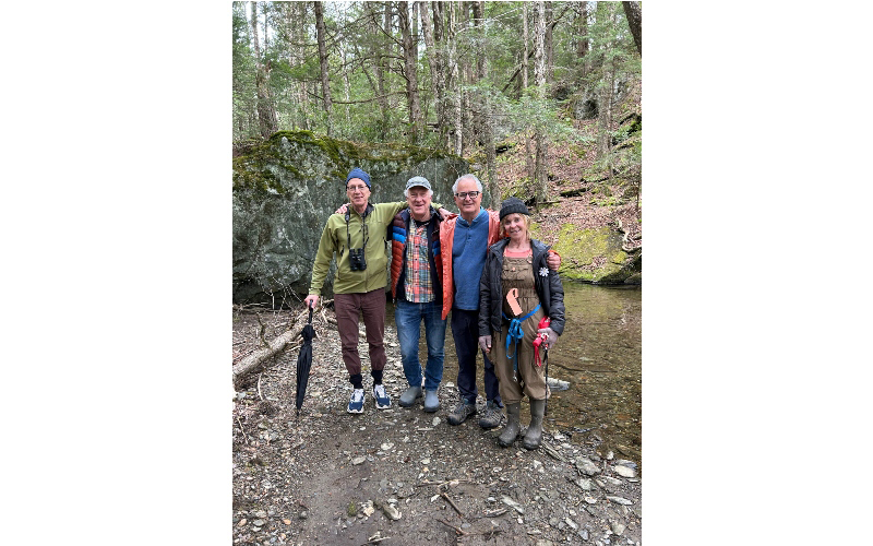 L to R, Marc, David, Paul, and Nella Wennberg at a stream on the protected Waterbury land, May 2026. Courtesy David Wennberg